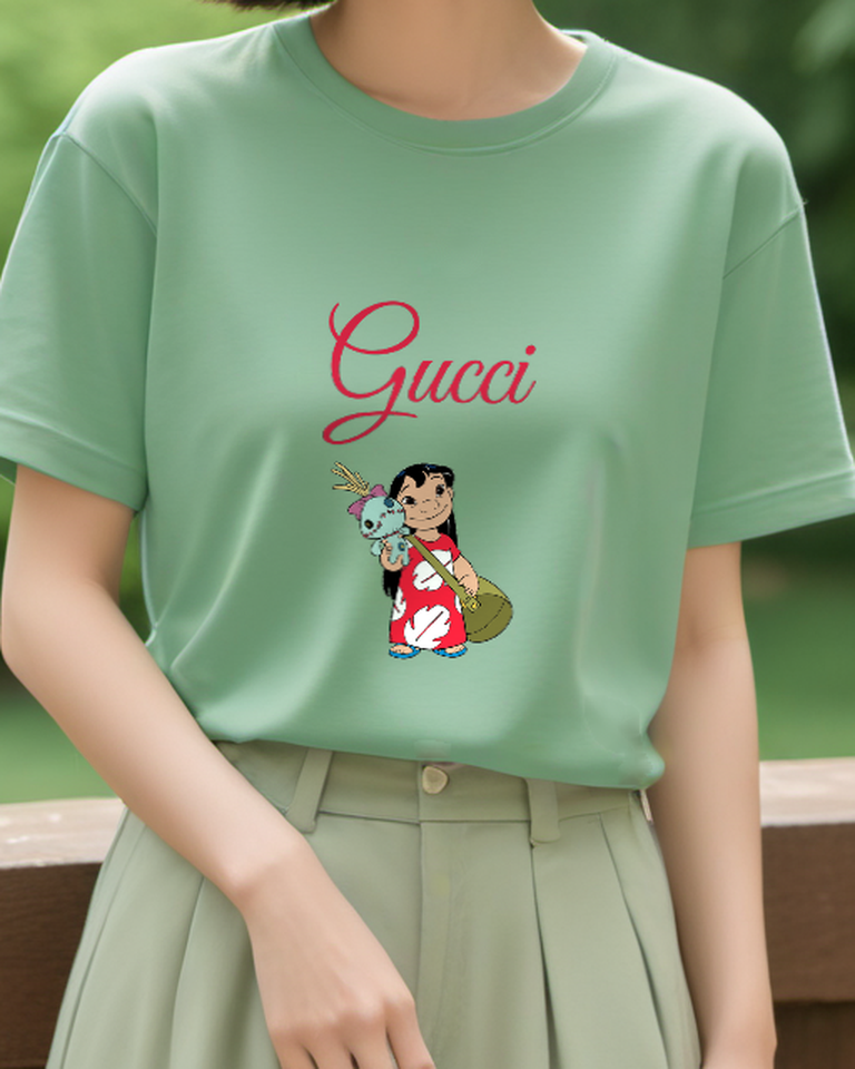 Sage Green Island Girl Carrying Blue Creature Graphic T-Shirt - model wearing view