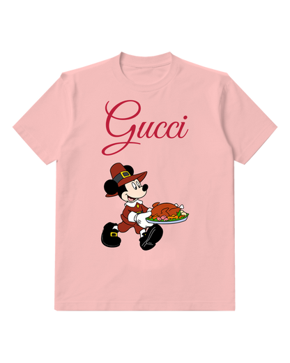 Blush Pink Mickey Mouse In Pilgrim Attire Carrying Turkey Graphic T-Shirt - front product view
